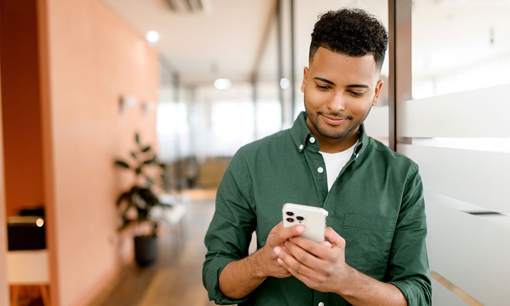 Business man looking at phone