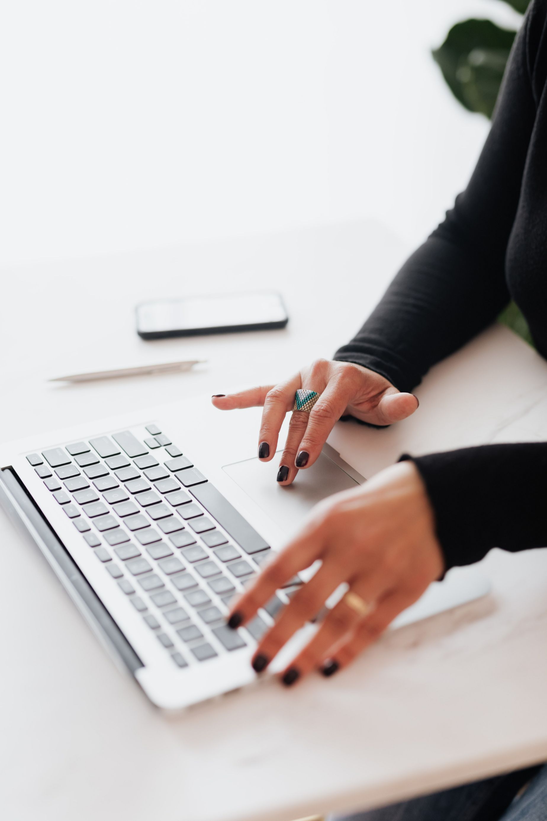 hands on a laptop keyboard