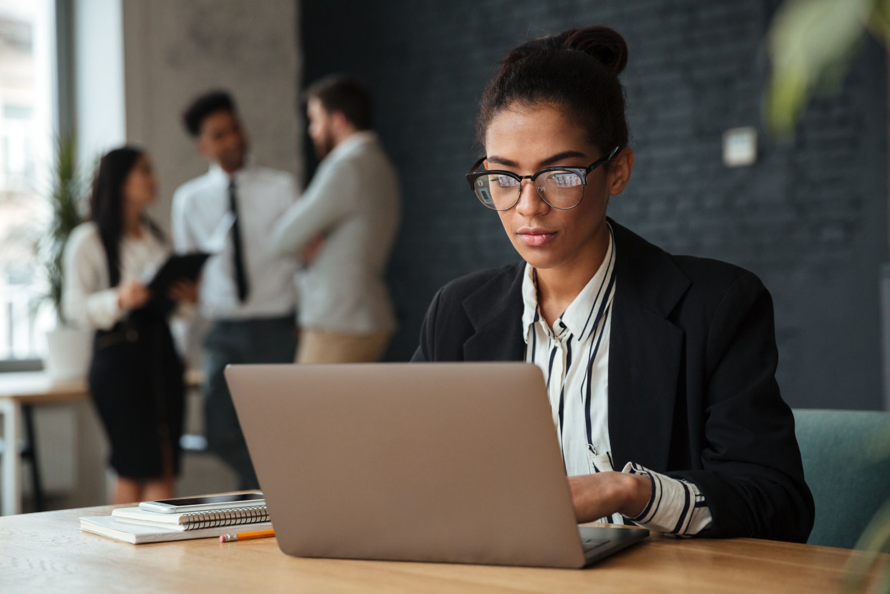 Woman working on computer on a desk