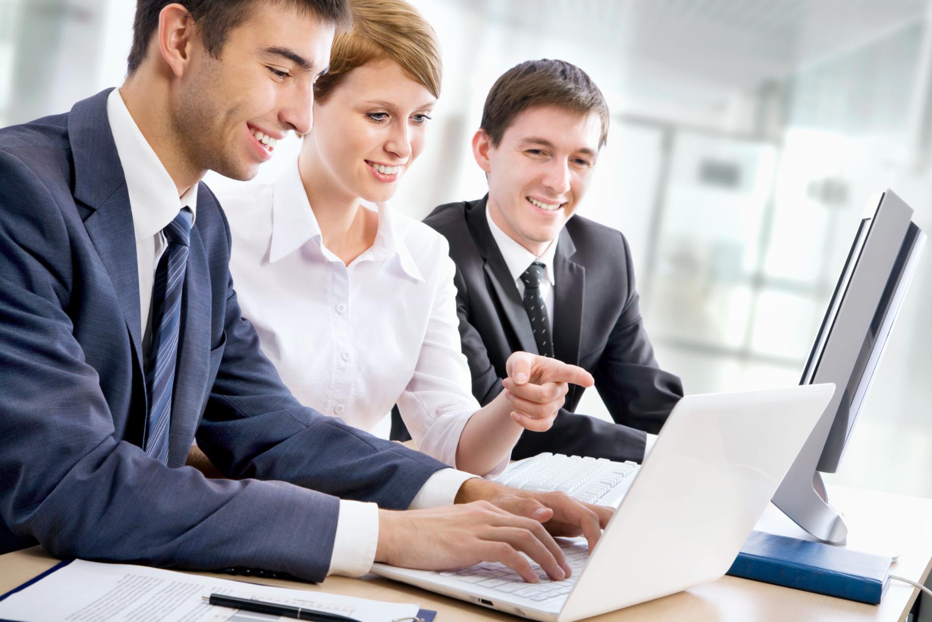 Business people working on a computer together