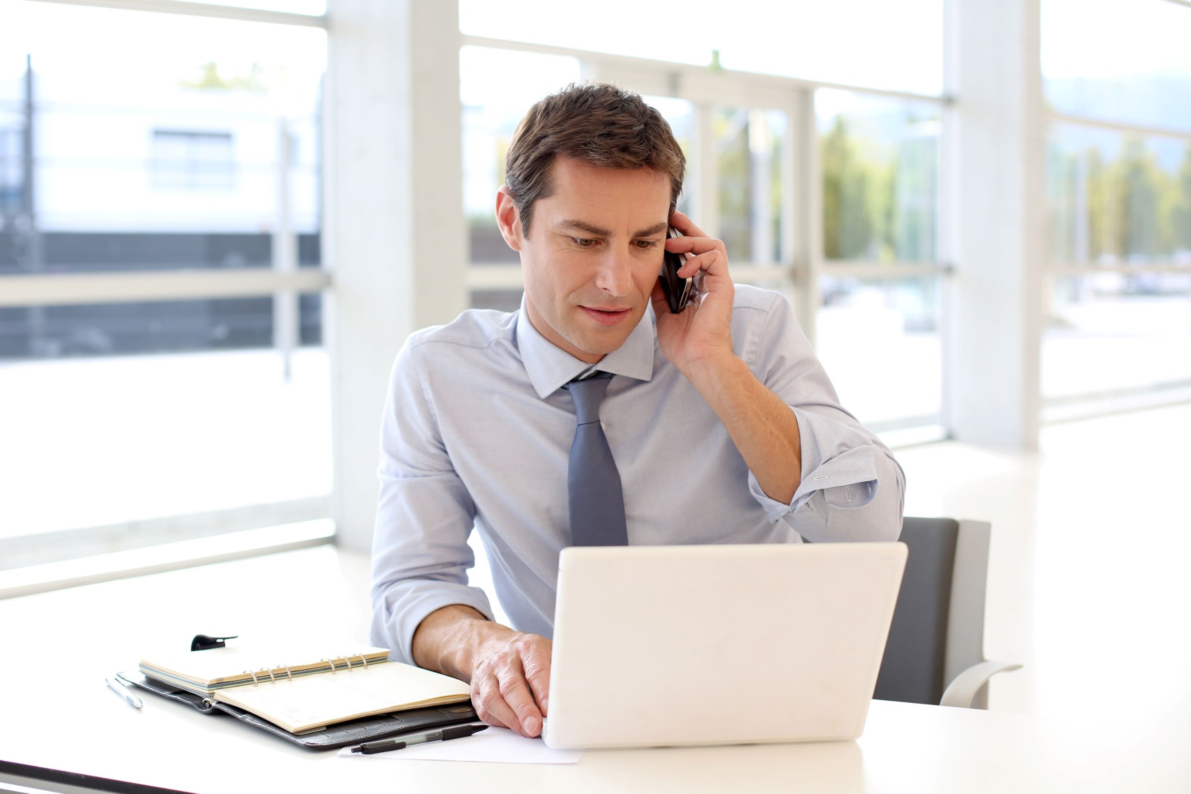 Businessman talking on phone in office