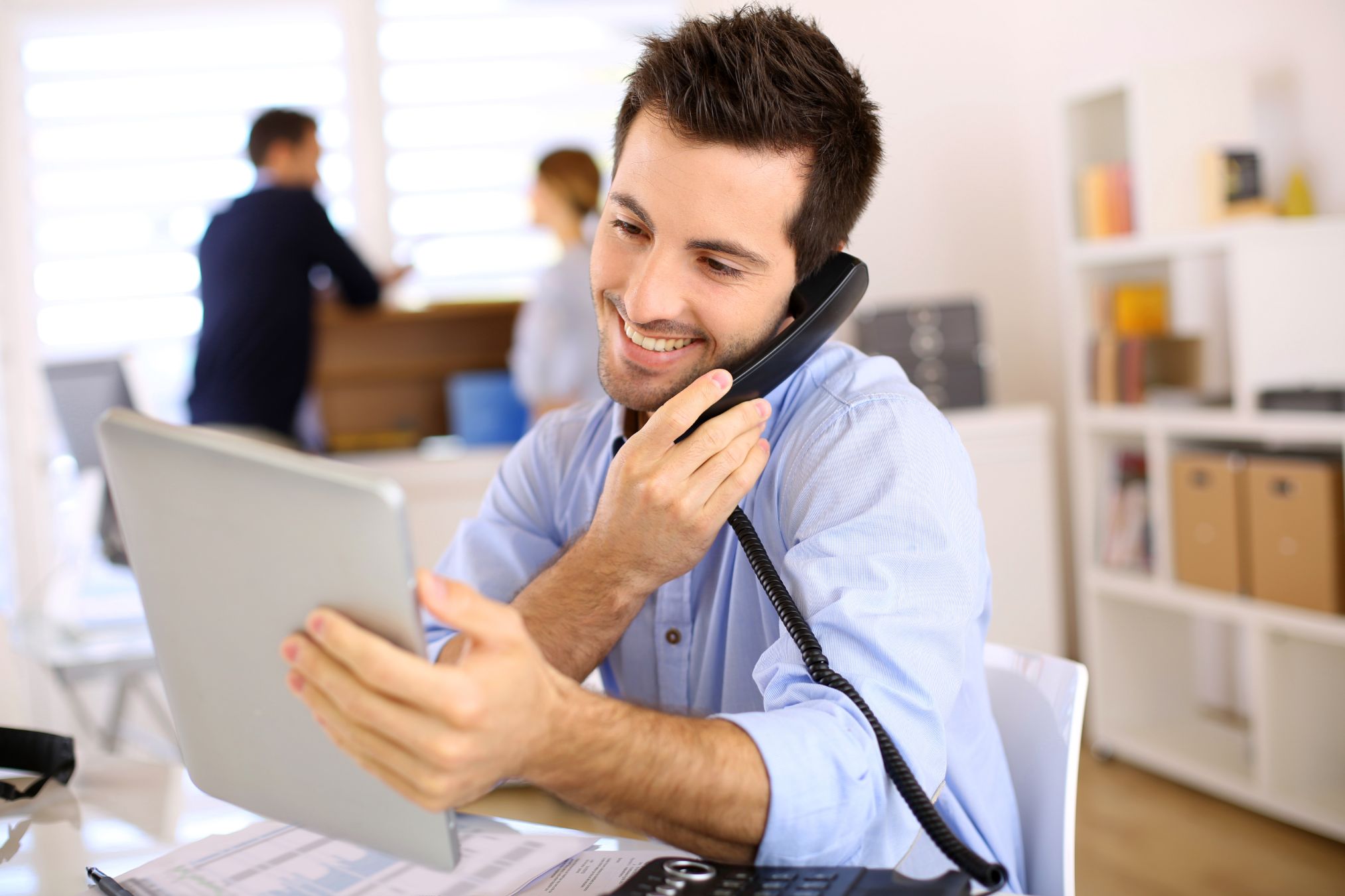 Man in office talking on phone