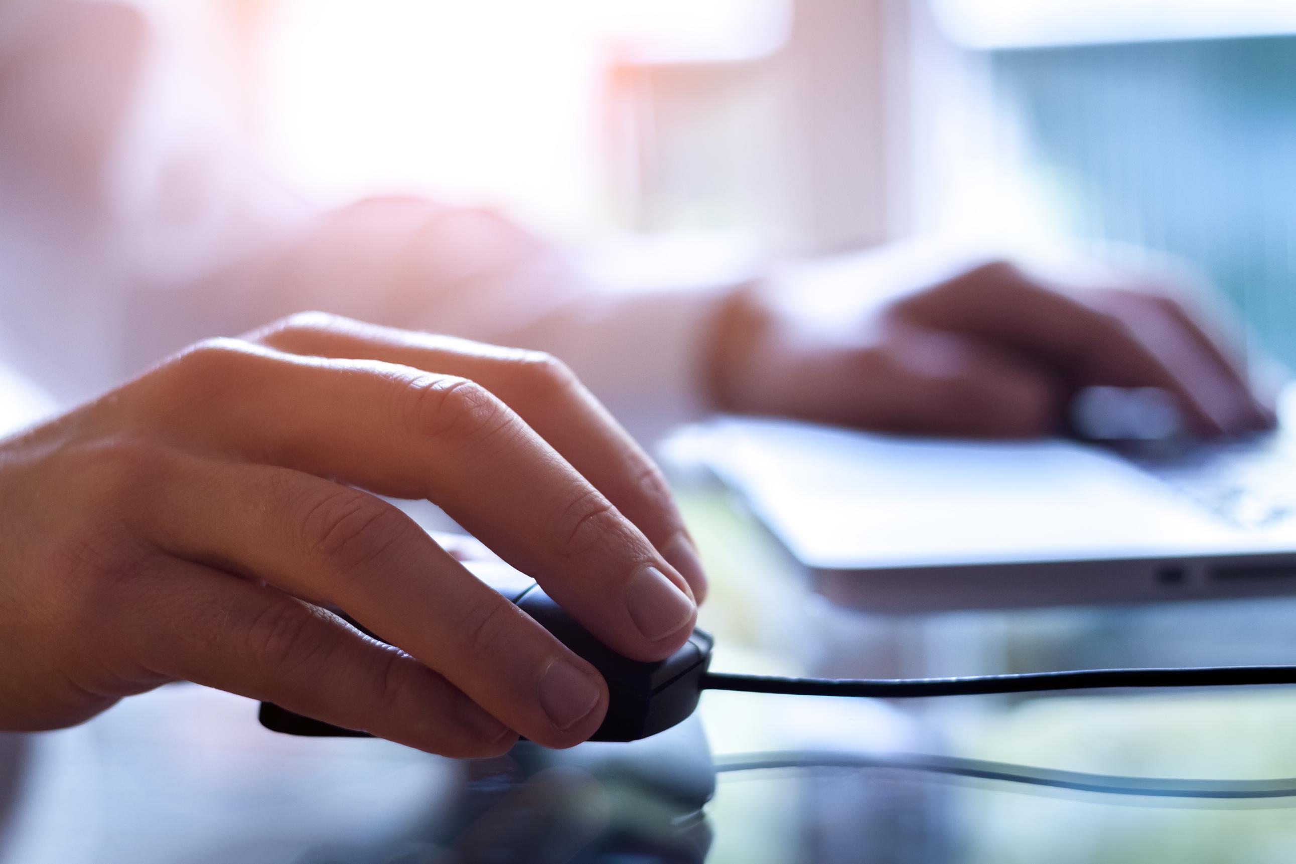 Close up of a hand on a computer mouse