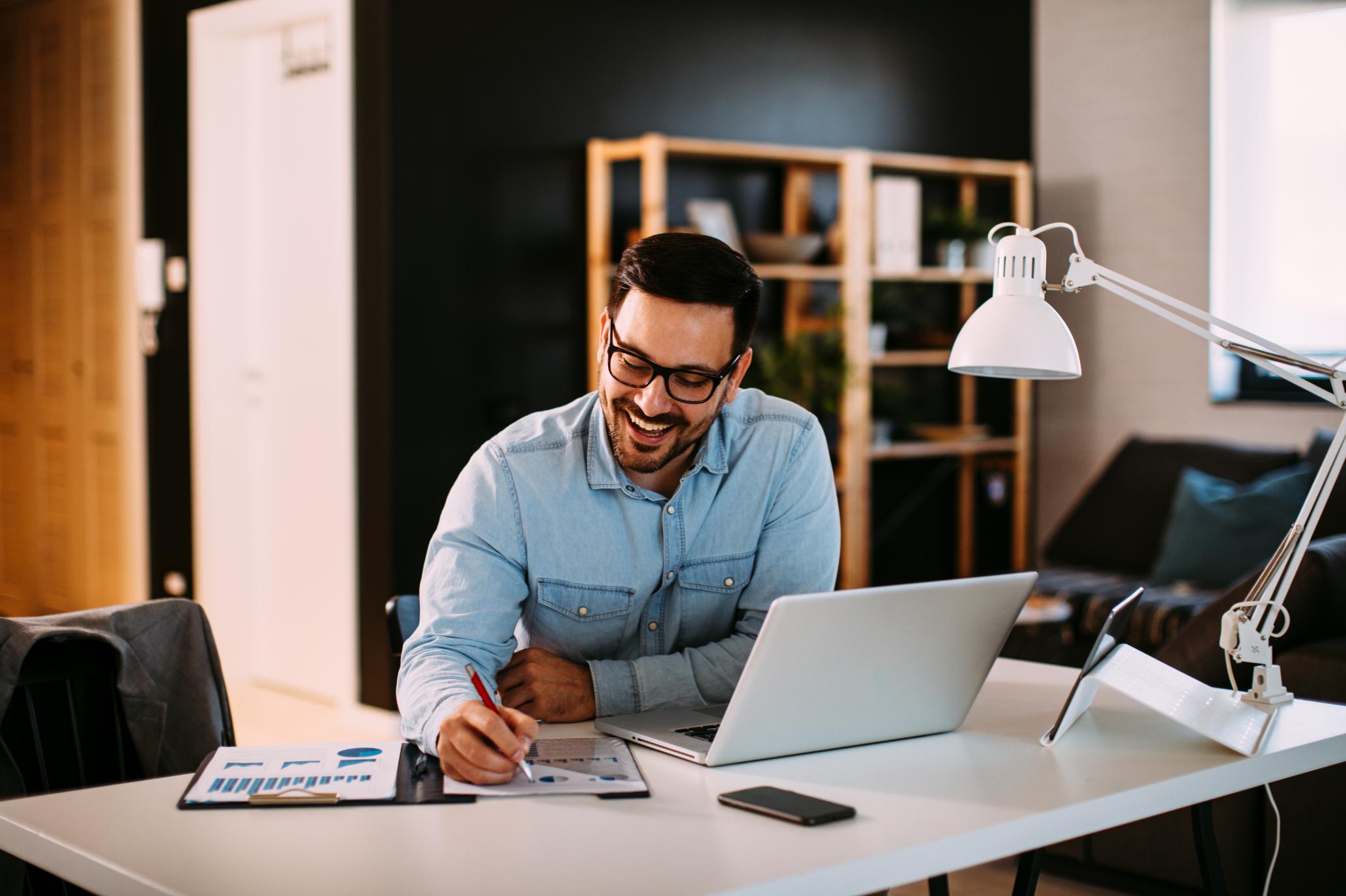 Business man working on a computer at a desk 