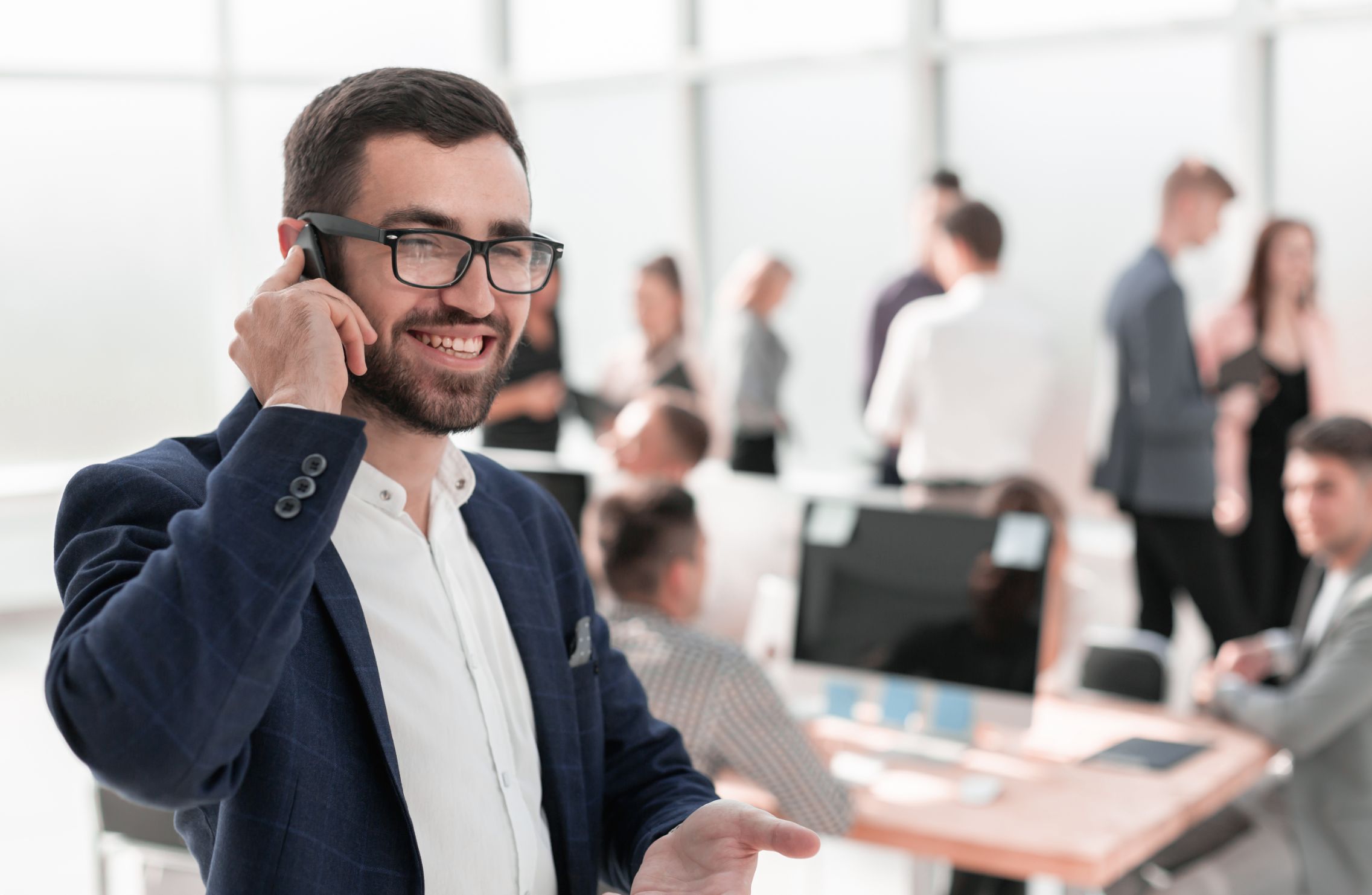 Business man talking on phone in an office