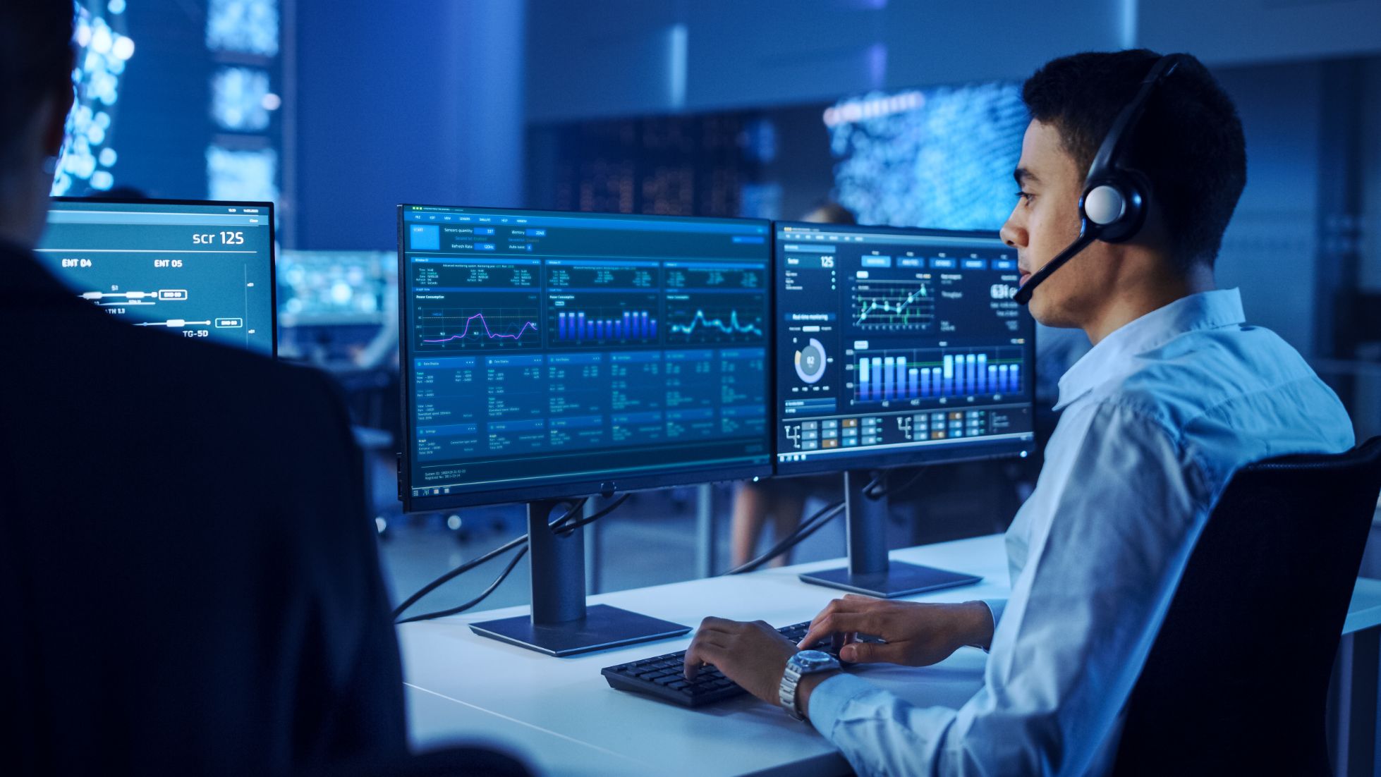 Man looking at data on a computer screen