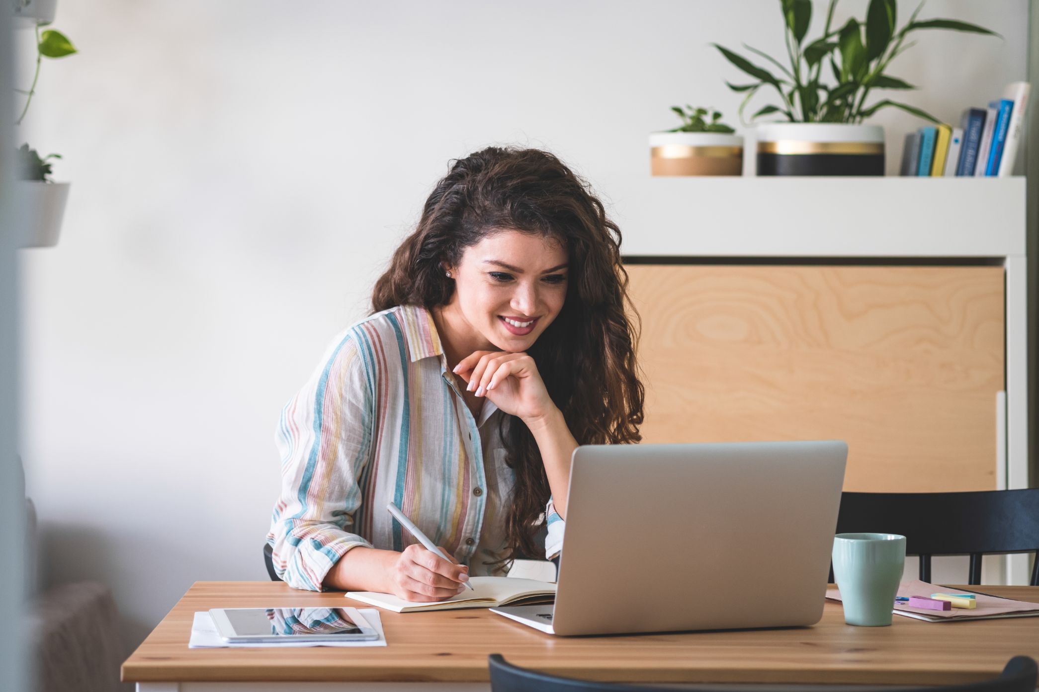 Business woman working on a computer at a desk