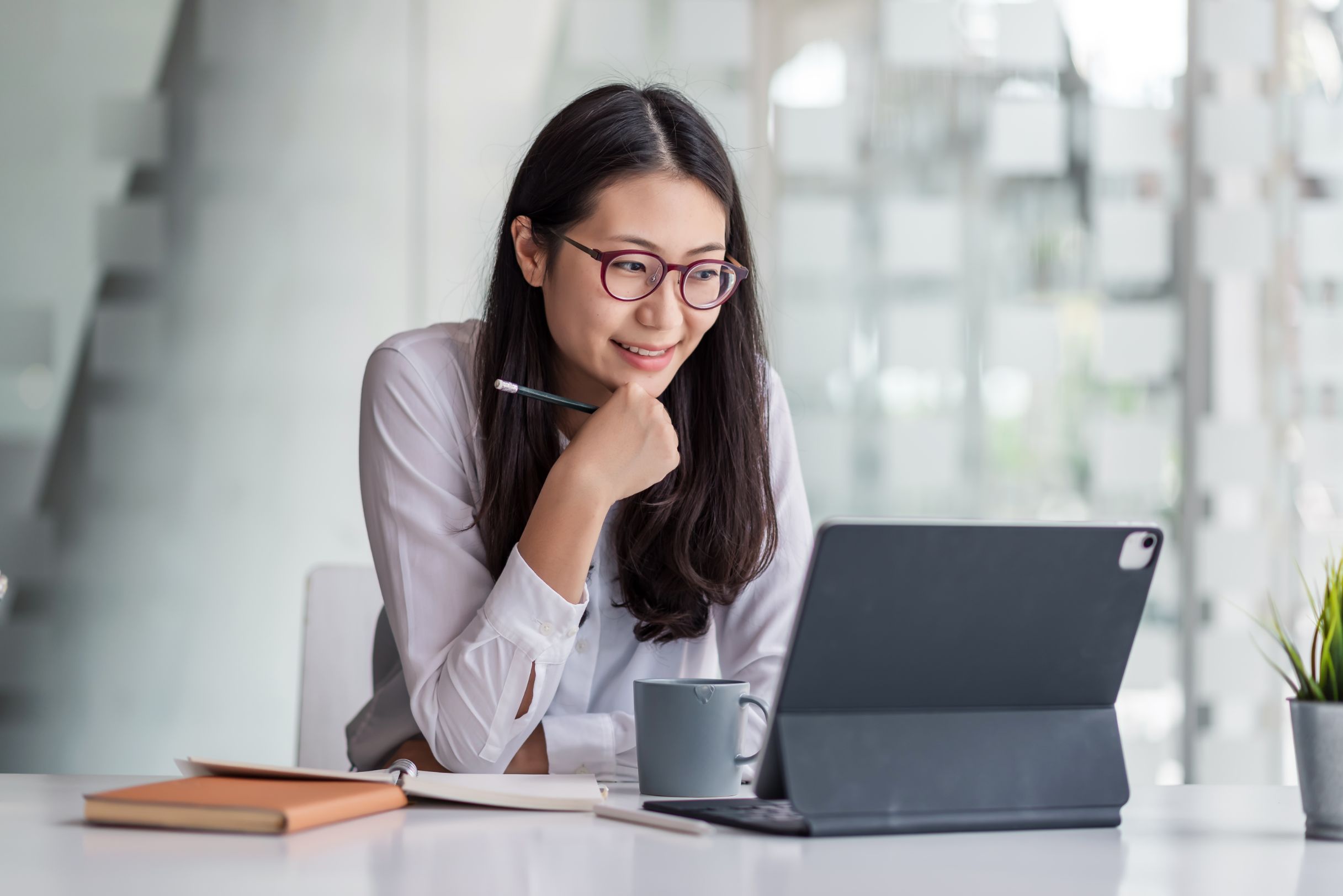 Business woman working on computer at a desk