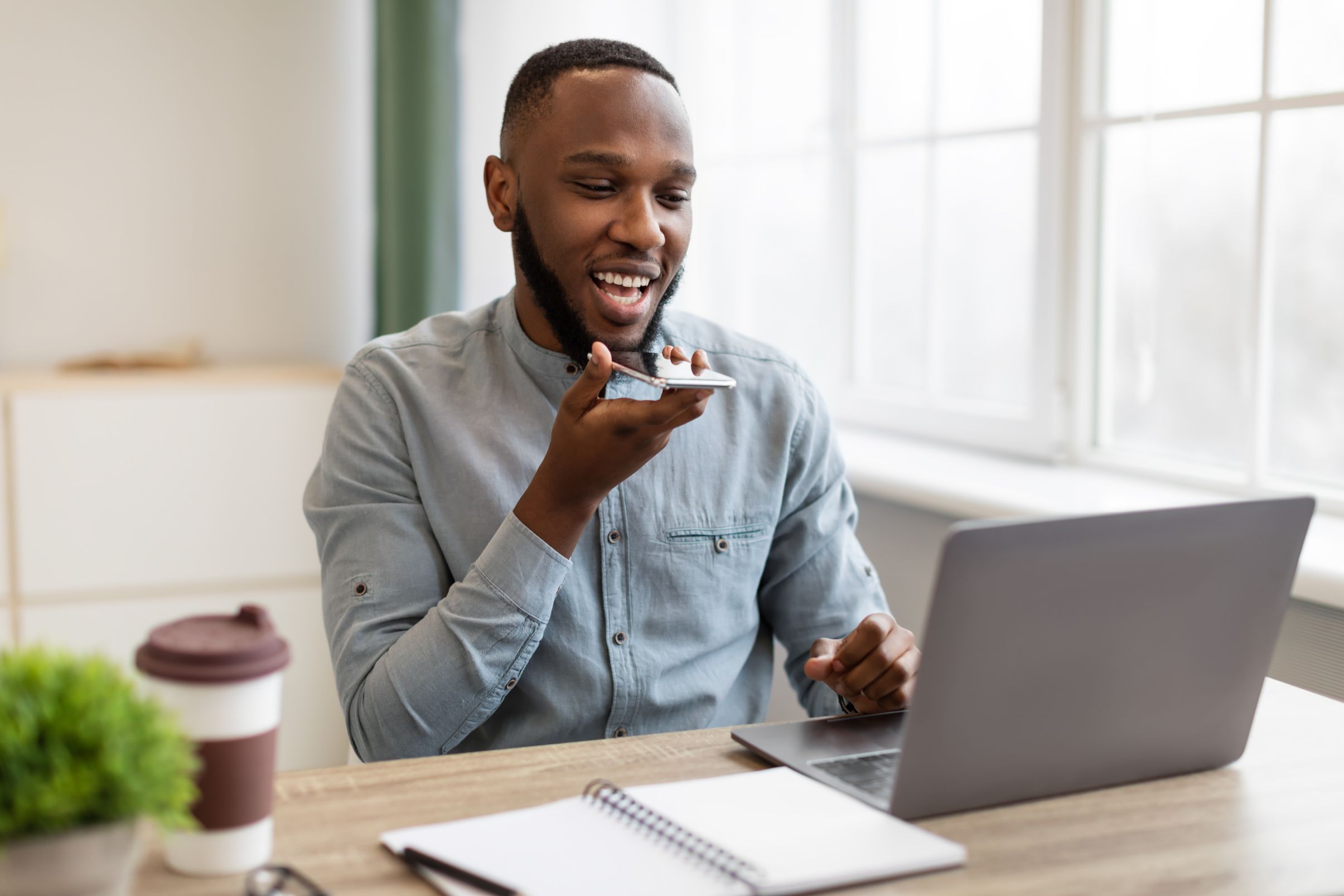 Business man talking on phone and working on computer