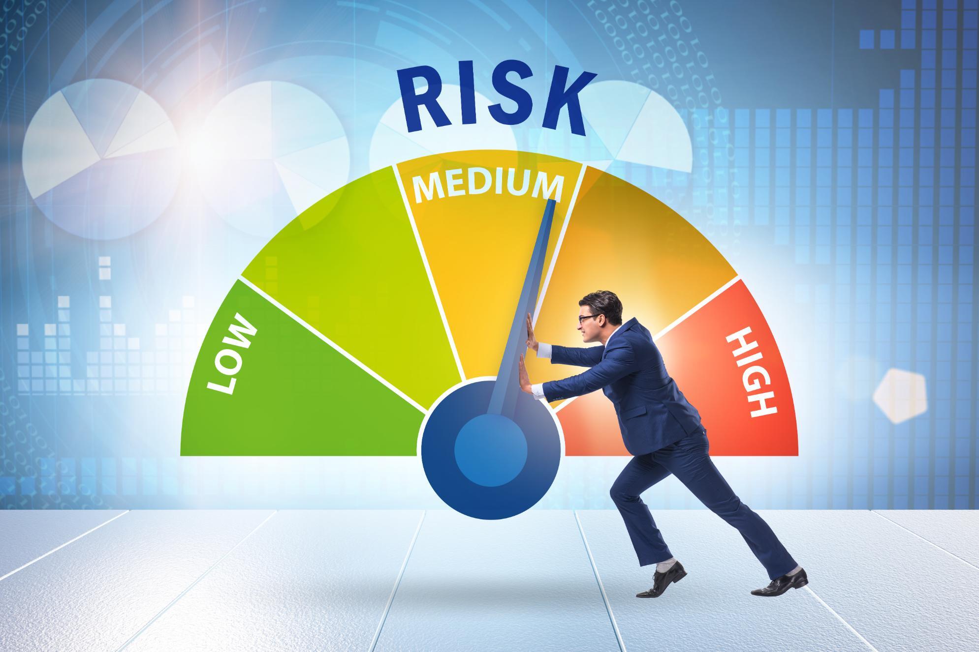 Graphic of risk meter with man pushing the needle to low