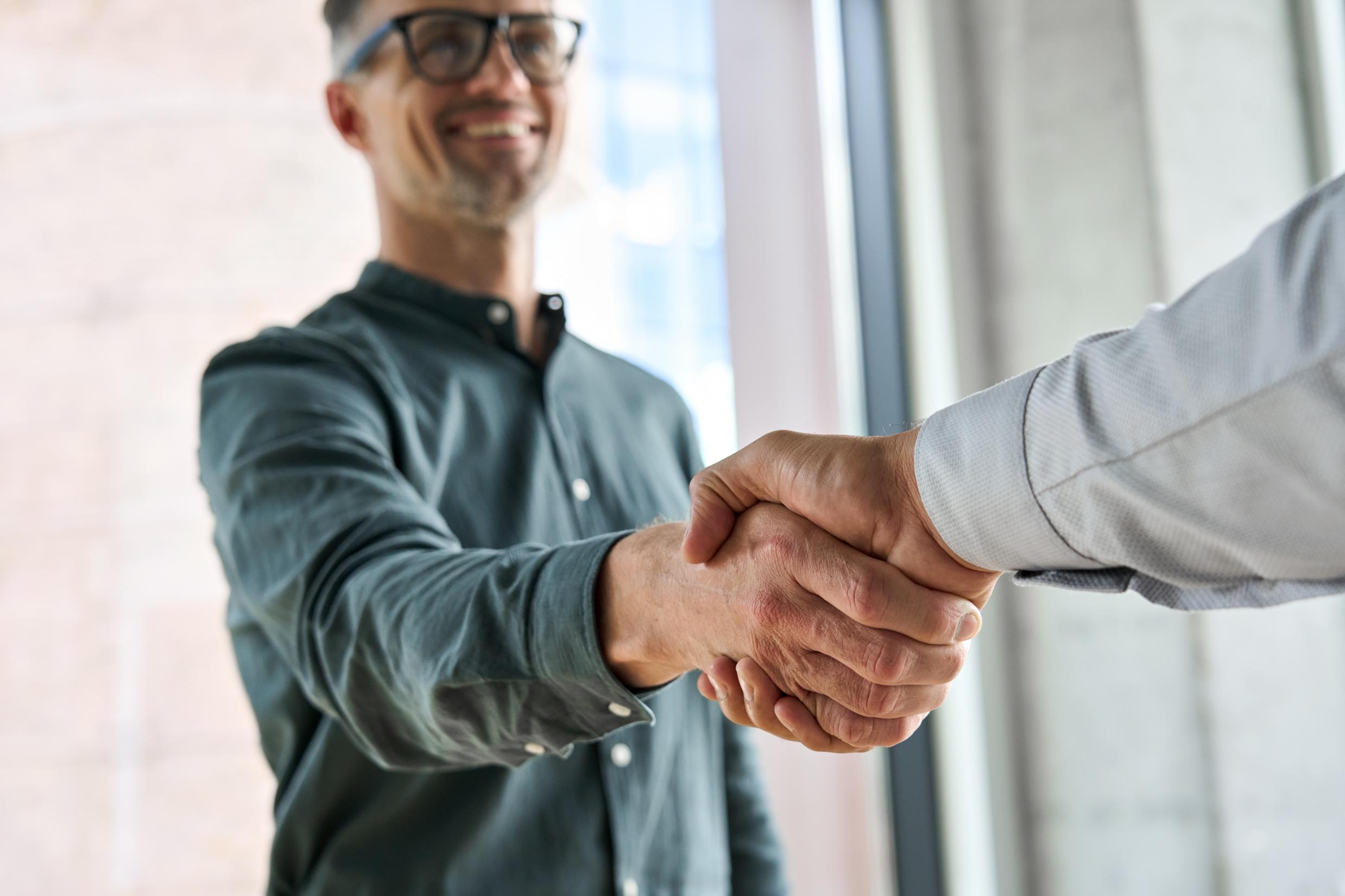 Two business men shaking hands