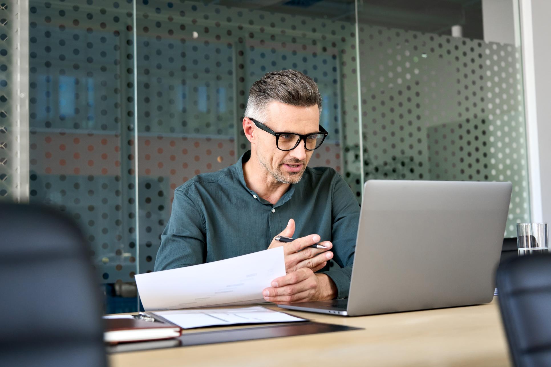 Business man working on a computer at a desk