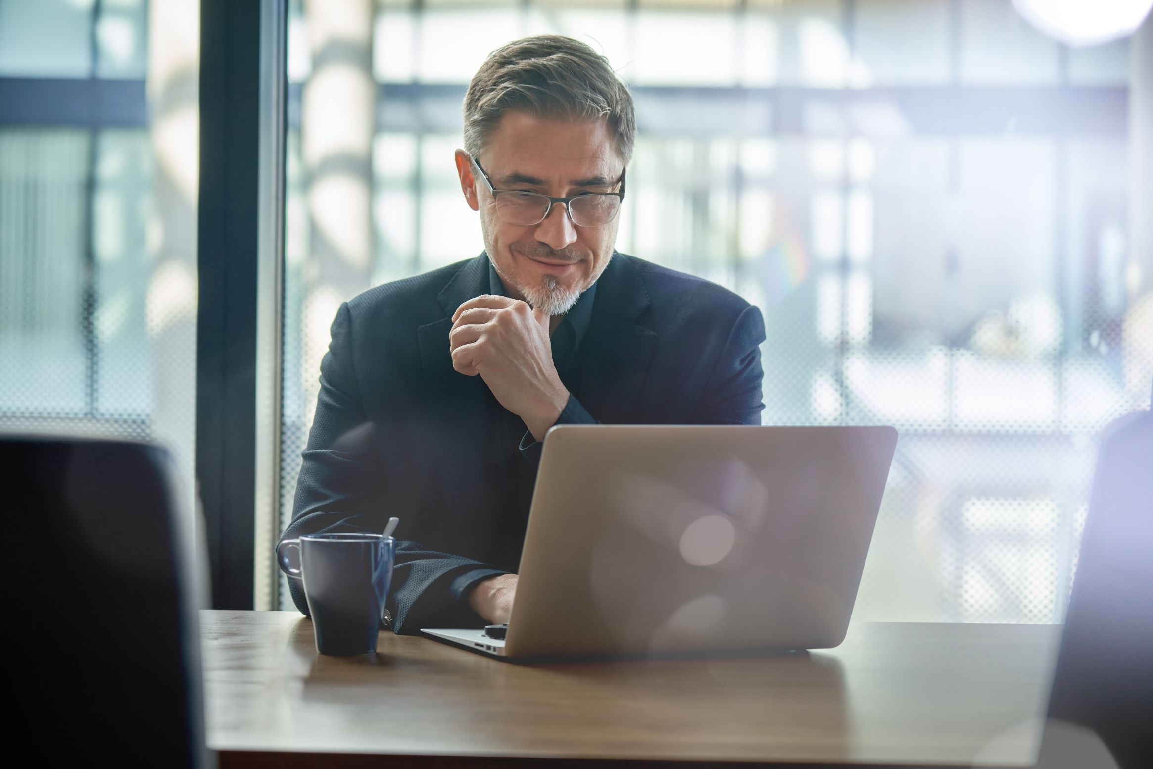 Business man working on a computer at a desk