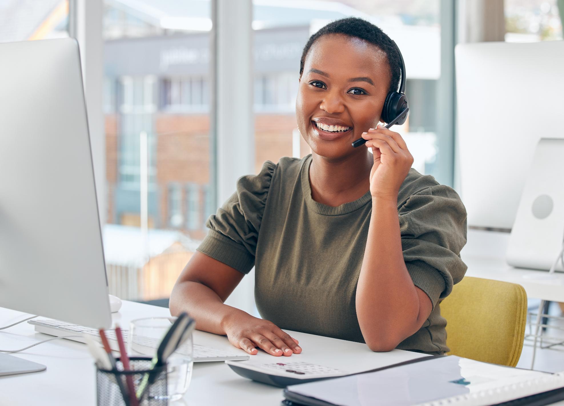 Business woman talking on the phone at a desk