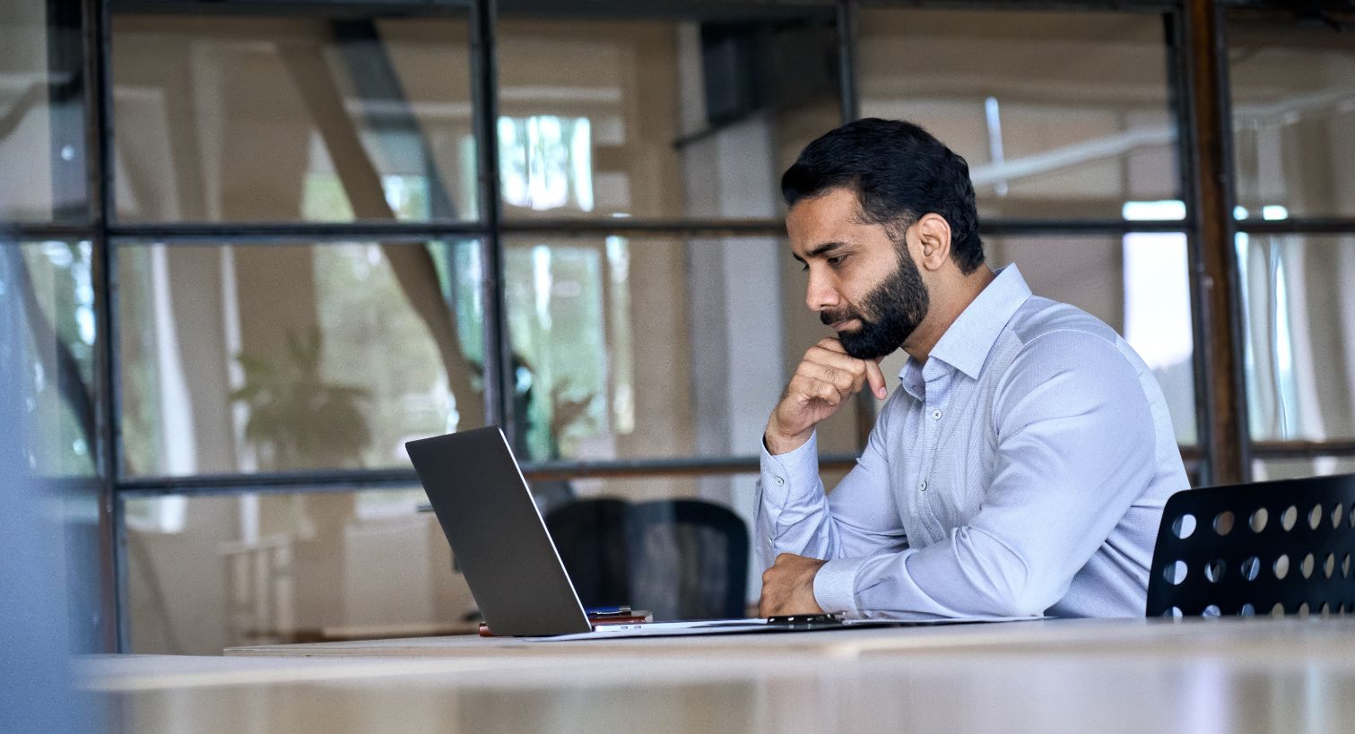 Business man working on computer at a desk 