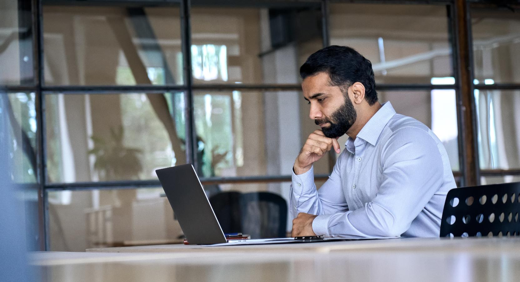 Business man working on a computer at a desk