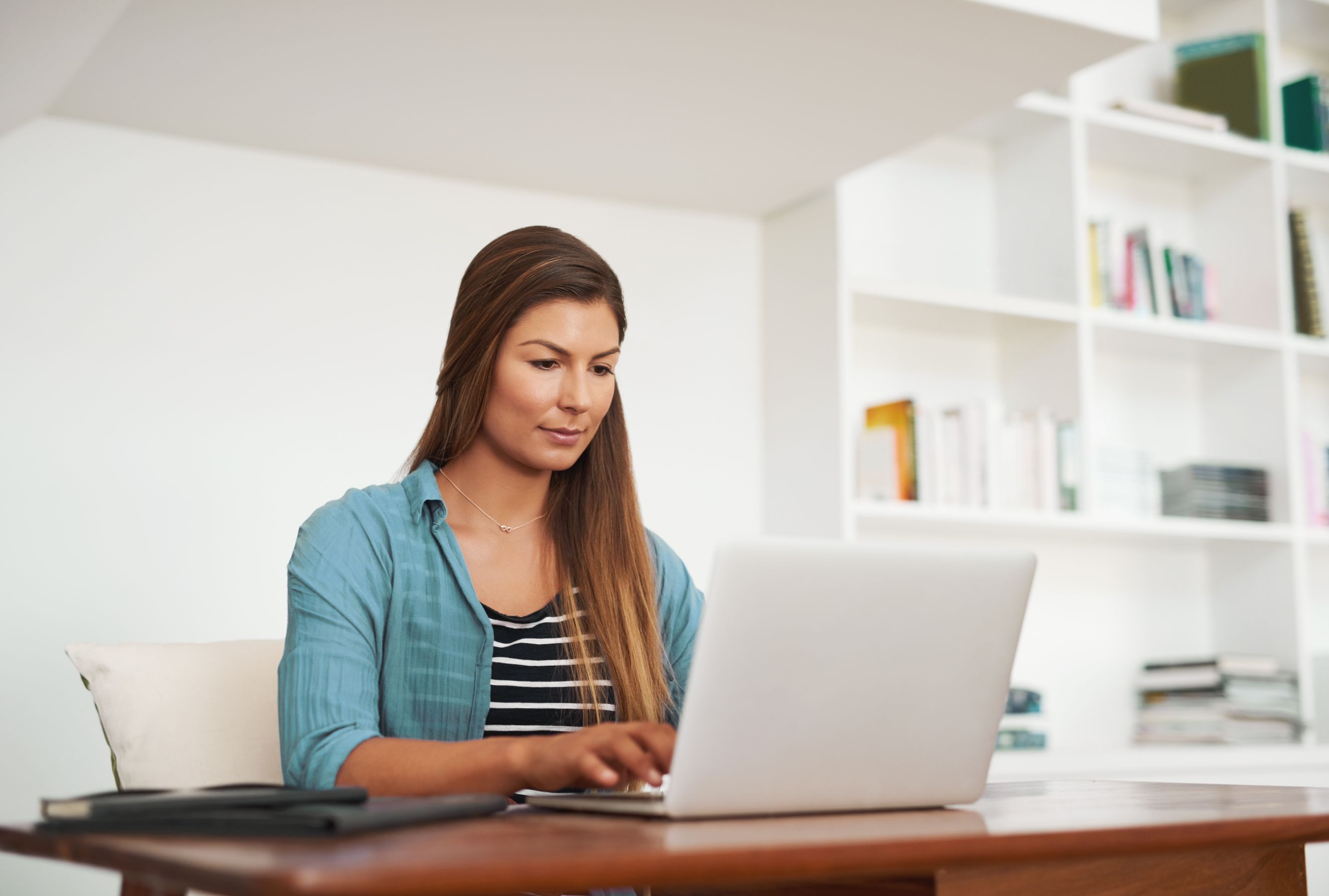 Business woman working on laptop at a desk