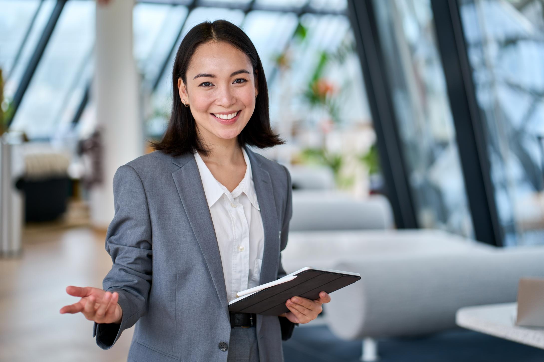 Business woman working on tablet on a couch 