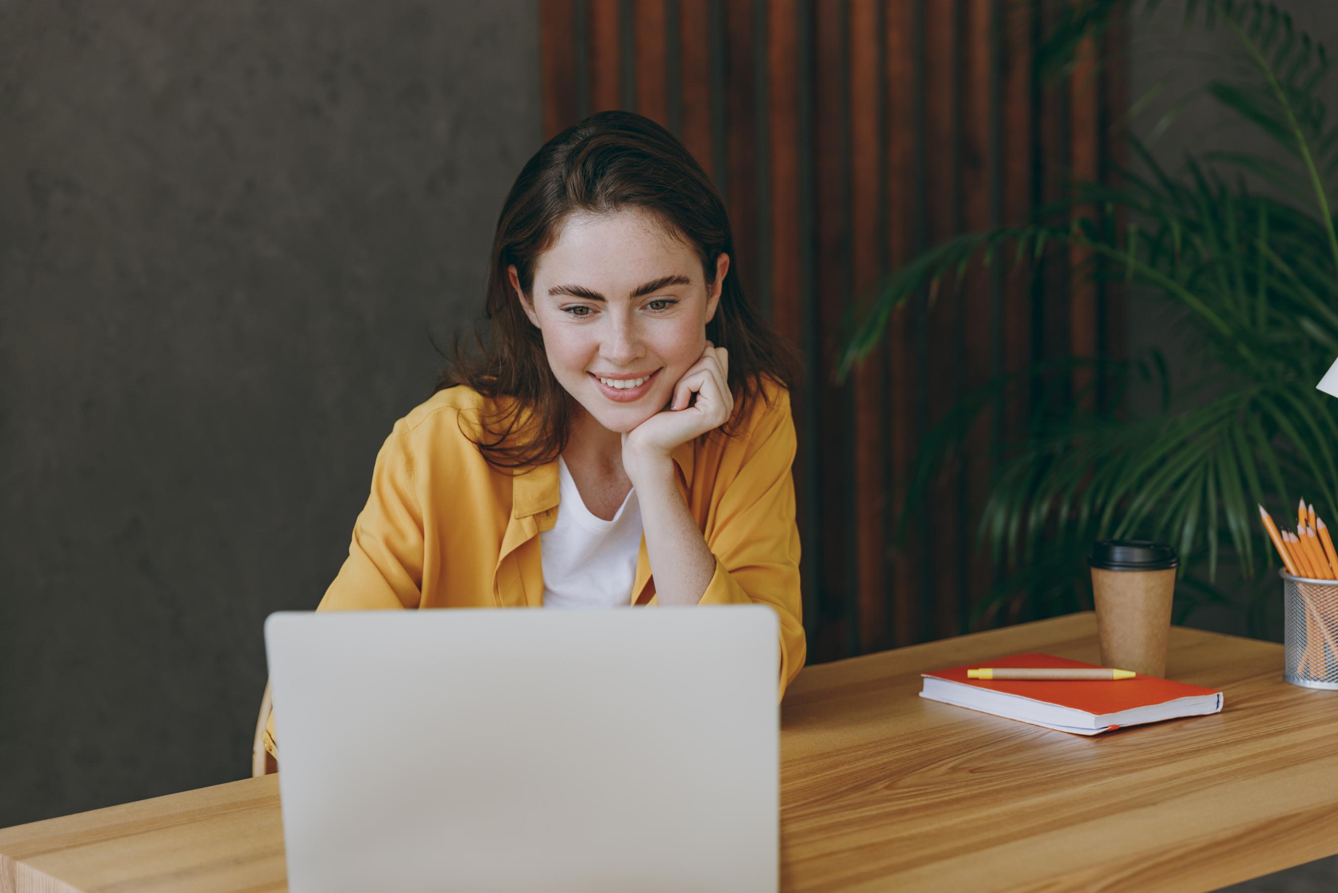 Business woman working on computer at a desk