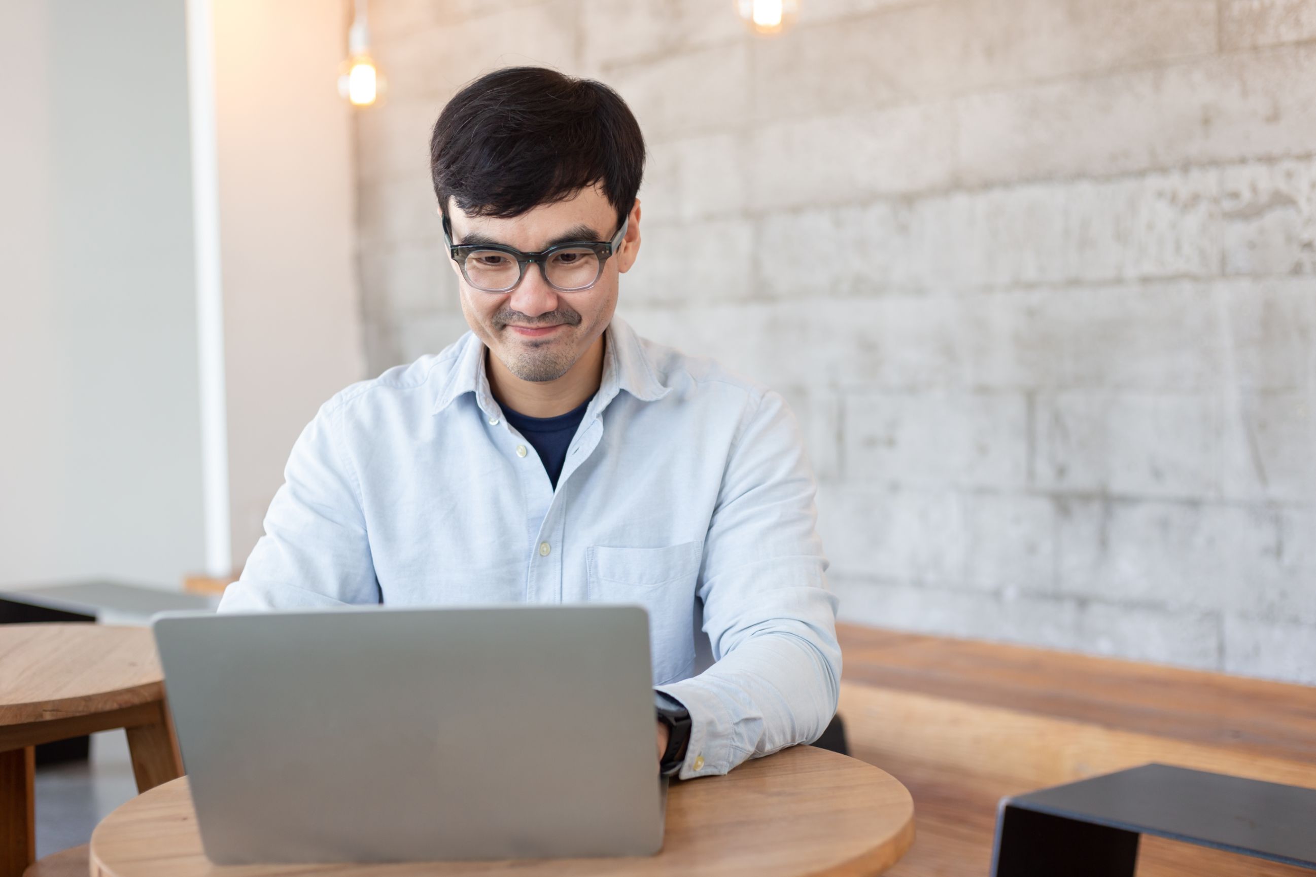 Business man working on computer at a desk 