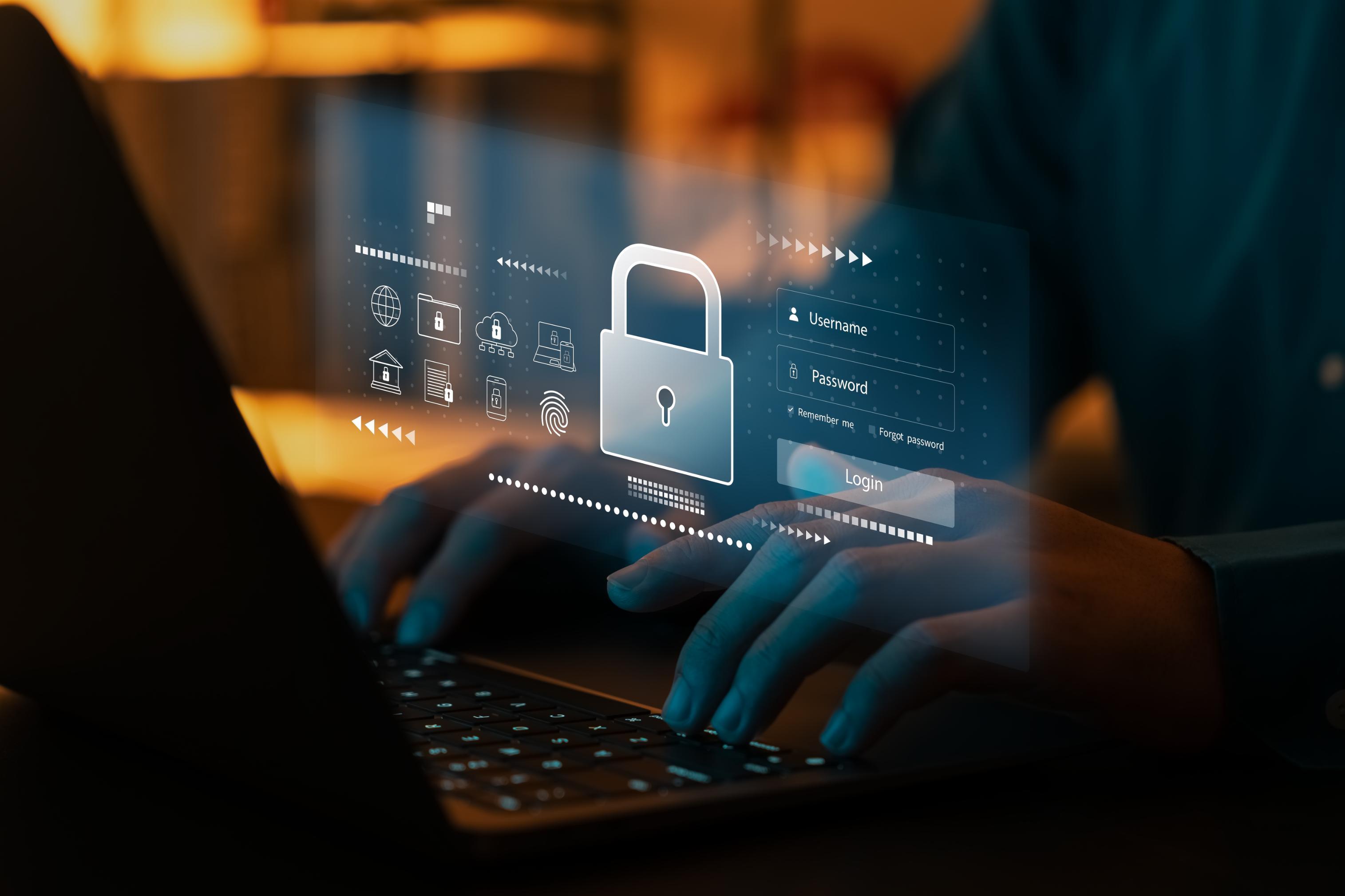 Person typing on a computer with security icon over the image