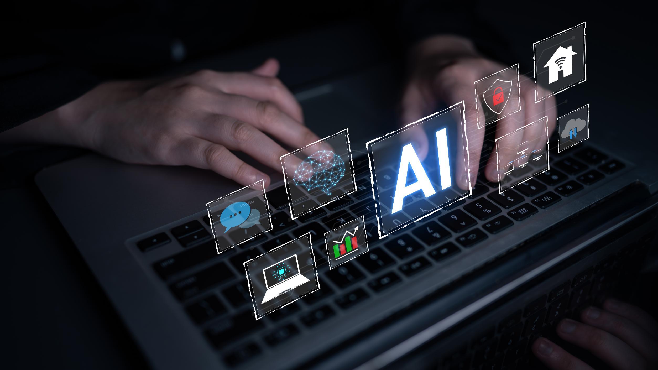 Person typing on computer with AI graphic over the image
