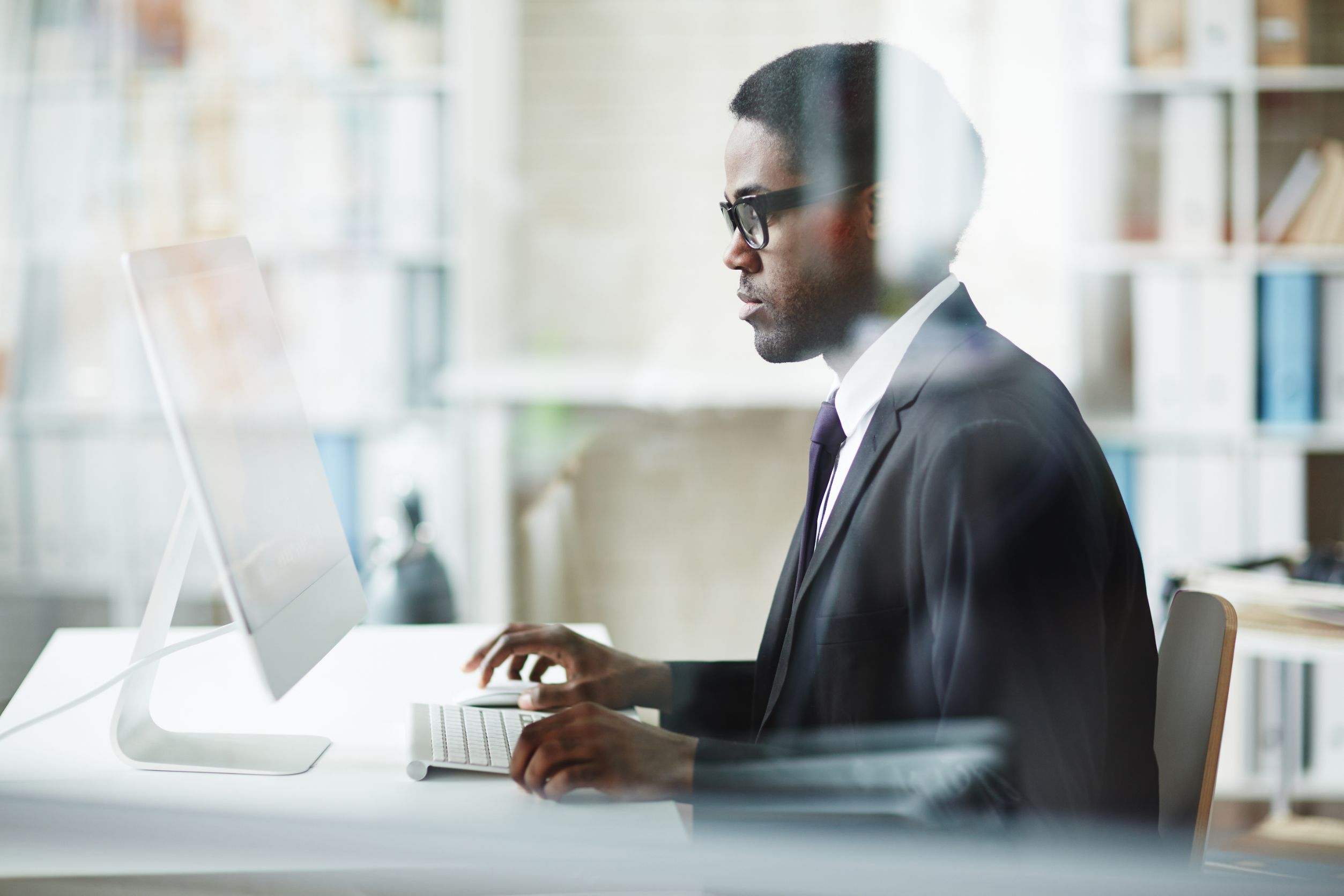 Business man working on computer at a desk