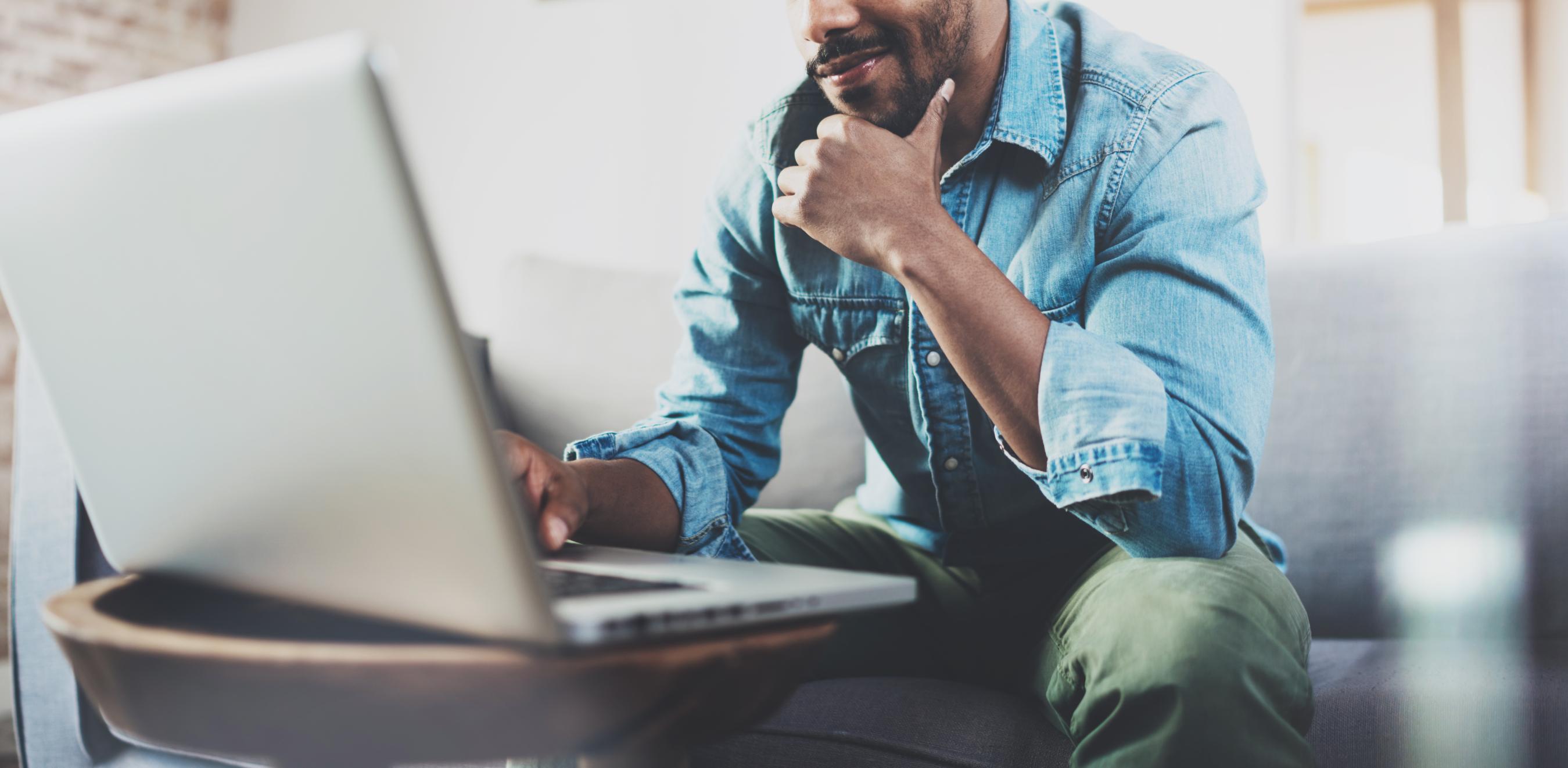 Business man working on computer at a table