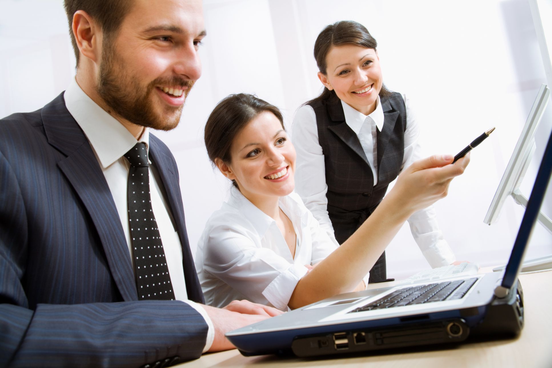 Business people working on a computer together