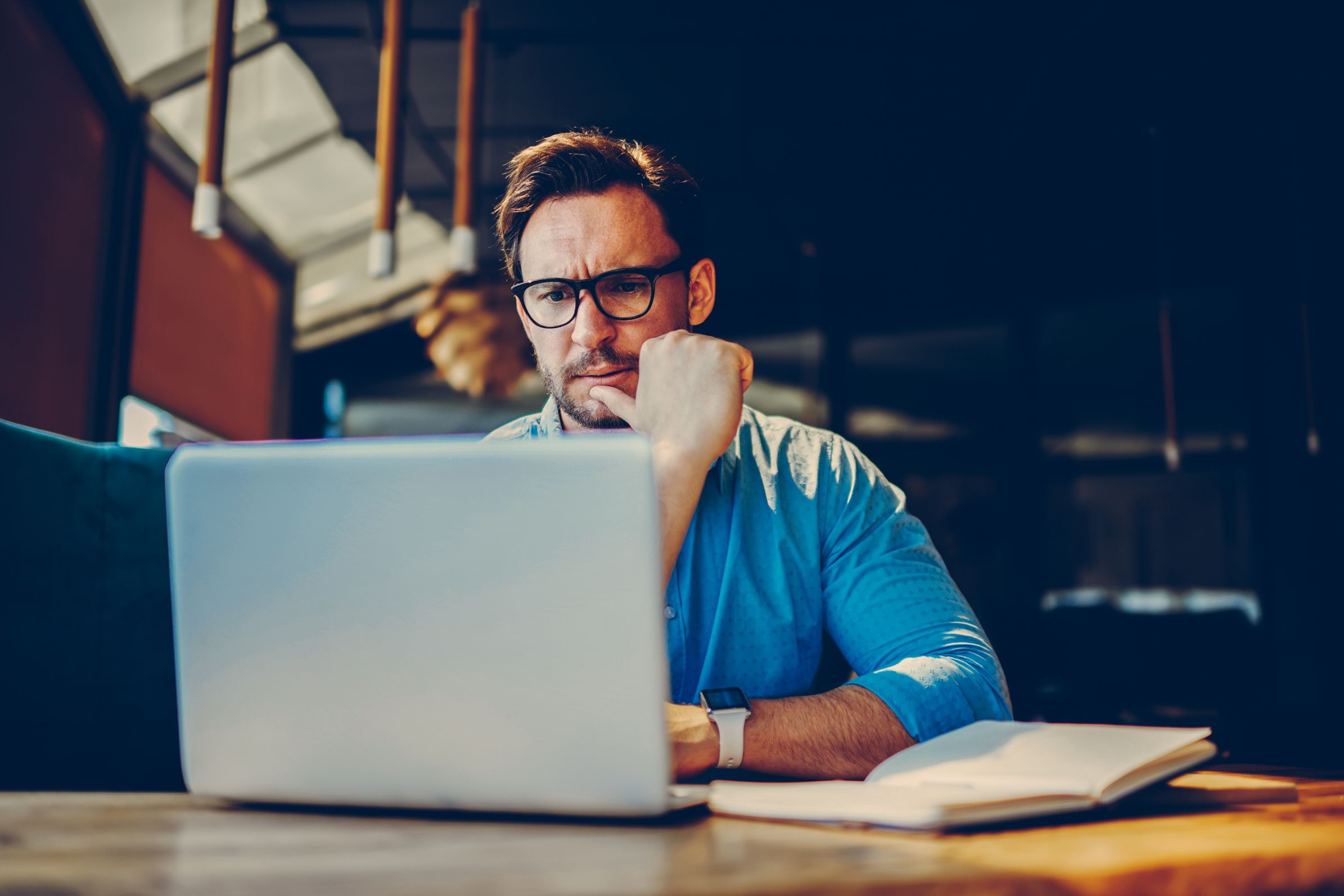 Business man working on computer at a desk 