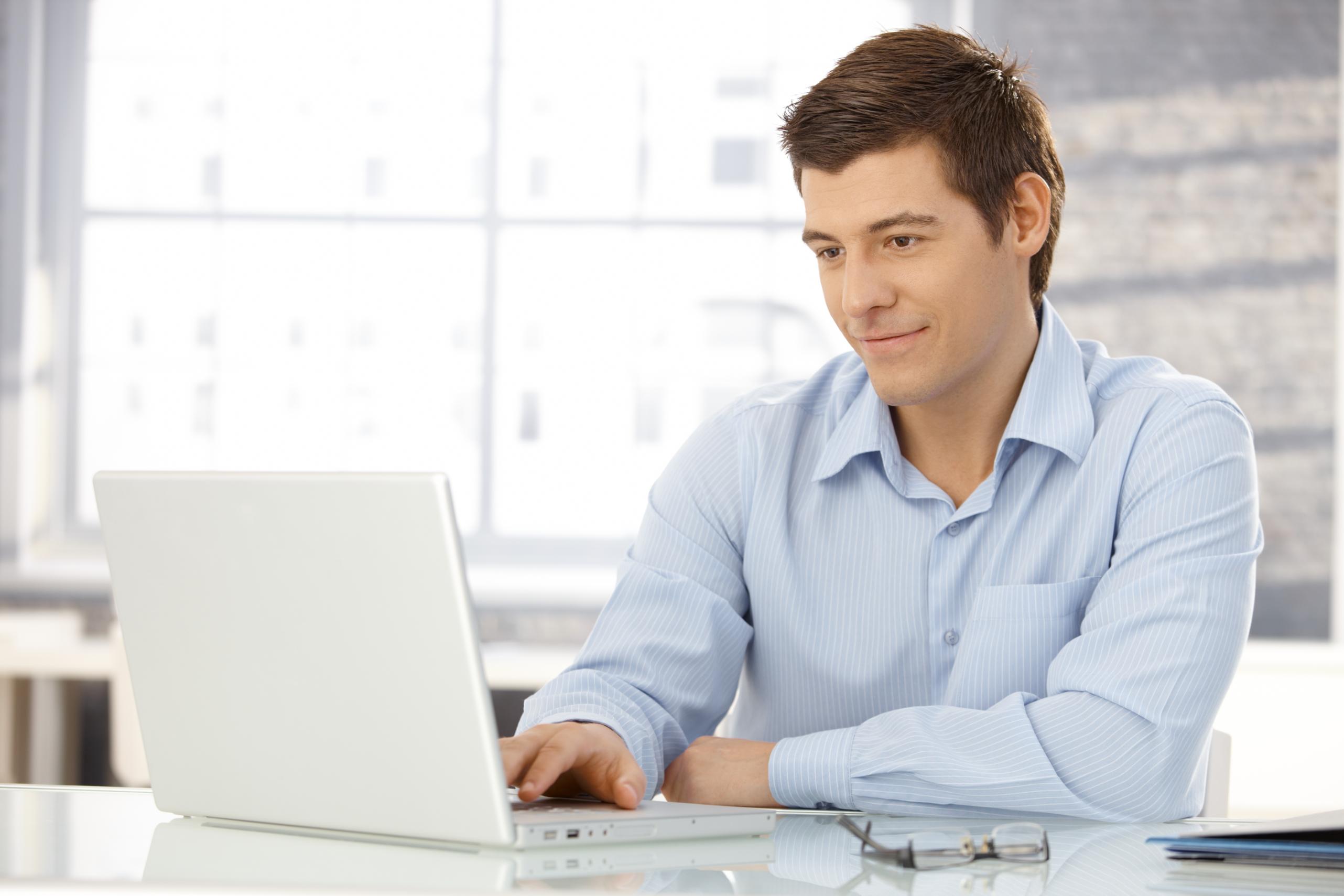 Business man working on a laptop at a desk